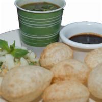 B5 Pani Puri · 6 puffed puris filled with potato, chickpeas, tamarind chutney served with chilled spicy water