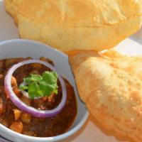 B15 Chole Bhatura · Deep fried puffed bread (2pcs) served with spicy chickpeas curry.