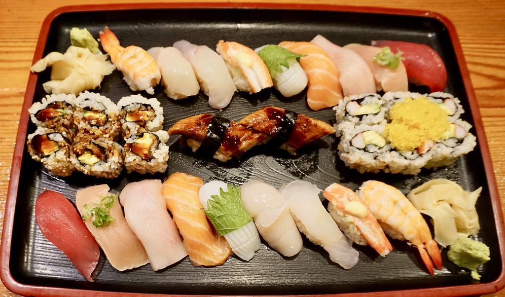 Sushi (For 2) · Tuna, yellowtail, salmon, white tuna, squid, scallop, shrimp, eel, red crab, eel cucumber roll, salmon avocado roll.