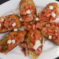 Bruschetta  · Onion, tomato, garlic, parsley, cheese & olive oil over toasted Italian bread.