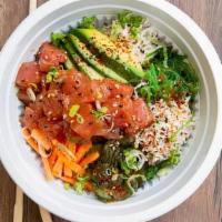 Poke Bowl · Served with steamed rice, wakame, scallions, carrot, avocado, sesame seeds, Tampico, Japanes...