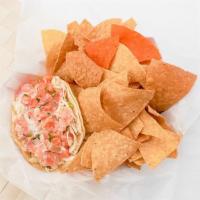 Fish Taco · Lightly breaded chunks of codfish, shredded cabbage, and pico de gallo topped with our delic...
