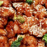Sesame Chicken · Hot and spicy. Served with fried rice and pork egg roll. Spicy.