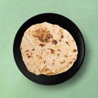 Chapati · Whole wheat flat bread baked to perfection over a flat griddle.