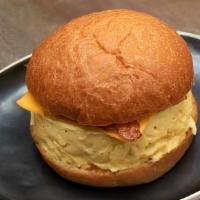 Egg Sandwich · Brioche Bun, American Cheese, Egg, Bacon, Butter