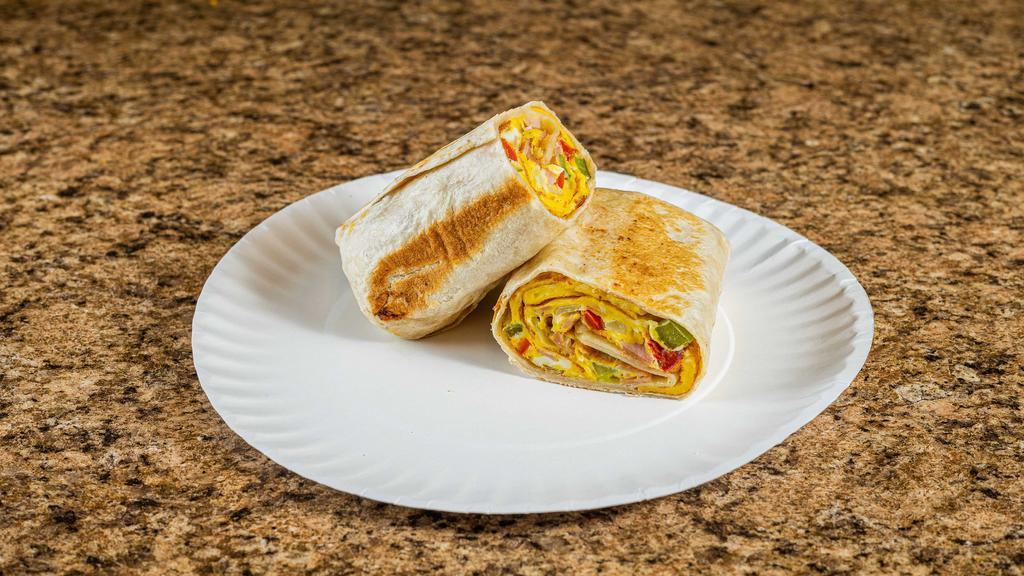South Of The Border Wrap · 2 scrambled eggs, diced peppers, chipotle chicken breast and pepper jack cheese with a touch of hot sauce.