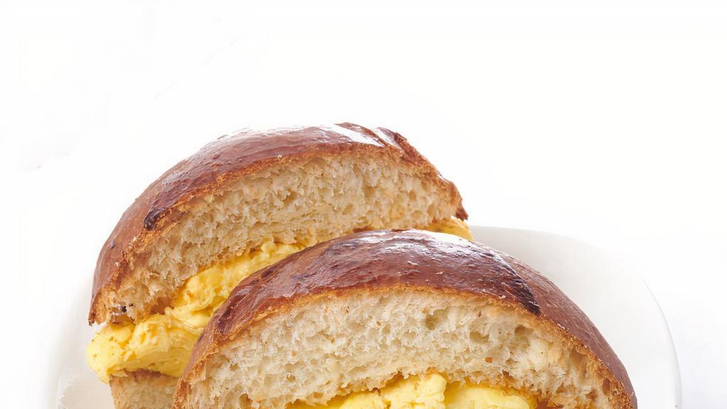 Egg & Cheese On Brioche · House baked toasted brioche bun filled with scrambled eggs and fontina cheese.