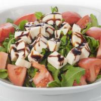 Caprese Salad · Fresh mozzarella, tomatoes, arugula and balsamic glaze.