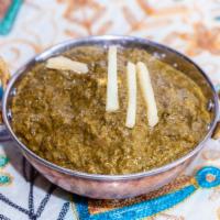 25) Saag Paneer · Homemade cheese cubes cooked in spinach & cream.