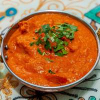 47) Chicken Tikka Masala · Boneless barbecued chicken cooked in a thick tomato, onion, & cream sauce.