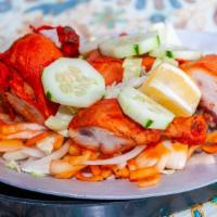 63) Tandoori Chicken · Marinated in tandoori masala & yogurt for 24 hours, barbecued to perfection in the tandoor.