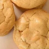 Macadamia White Chocolate Chip Cookies · White chocolate chip cookies with chunks of coarsely chopped macadamia nuts.