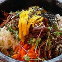 Dolsot Bibimbap / 돌솥비빔밥 · Vegetarian. Rice with mixed vegetables on a sizzling stone pan (a choice of bulgogi, spicy p...