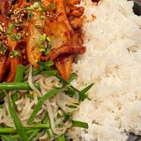 Spicy Squid Rice / 오징어덮밥 · Spicy. Spicy squid over rice on a sizzling stone pan.