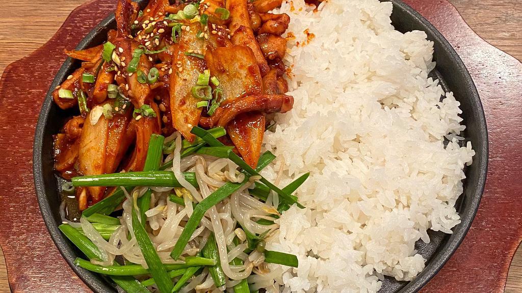 Spicy Squid Rice / 오징어덮밥 · Spicy. Spicy squid over rice on a sizzling stone pan.