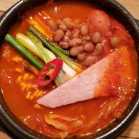 Budae Jjigae / 부대찌개 · Spicy. Spicy stew with sausage, ham, cream cheese & baked bean with ramen noodle.