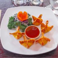 Crispy Crab Rangoon · Crab meat with celery, scallion and Philadelphia cream cheese wrapped in wonton skin, deep f...