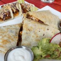 Rancho Quesadilla · Top menu item. Folded flour tortilla stuffed with seasoned shredded chicken, chihuahua and o...