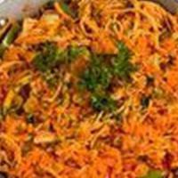 Arroz Con Pollo Criollo · Yellow rice with shredded chicken, mixed peppers, carrots and peas.