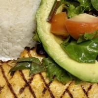 Pollo Aljibe · Boneless chicken breast marinated in citrus sauce and topped with mix greens, avocado, tomat...