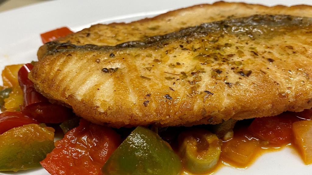 Salmon Bayamo · Salmon steak sauteed in a white wine with onions, peppers, capers, anchovies and tomato sauce.