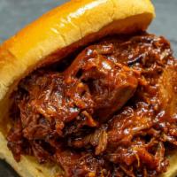 Bbq Pulled Turkey · Slow roasted turkey dark meat cooked in our house-made bbq sauce. Served hot with a Martin's...