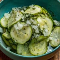 Cucumber Salad · Fresh cucumbers with vinegar, white onion, and dill.