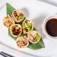 Duck Roll · Shredded boneless duck, scallion, cucumber, carrot and mix green wrap with tortilla with hoi...