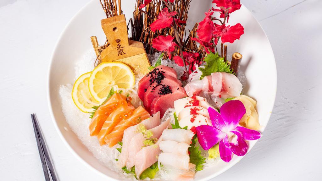 18 Piece Sashimi Deluxe · Served with miso soup or salad.