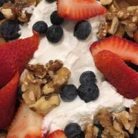 Multi-Grain Waffle · Topped with low-fat Greek yogurt, berries and nuts.