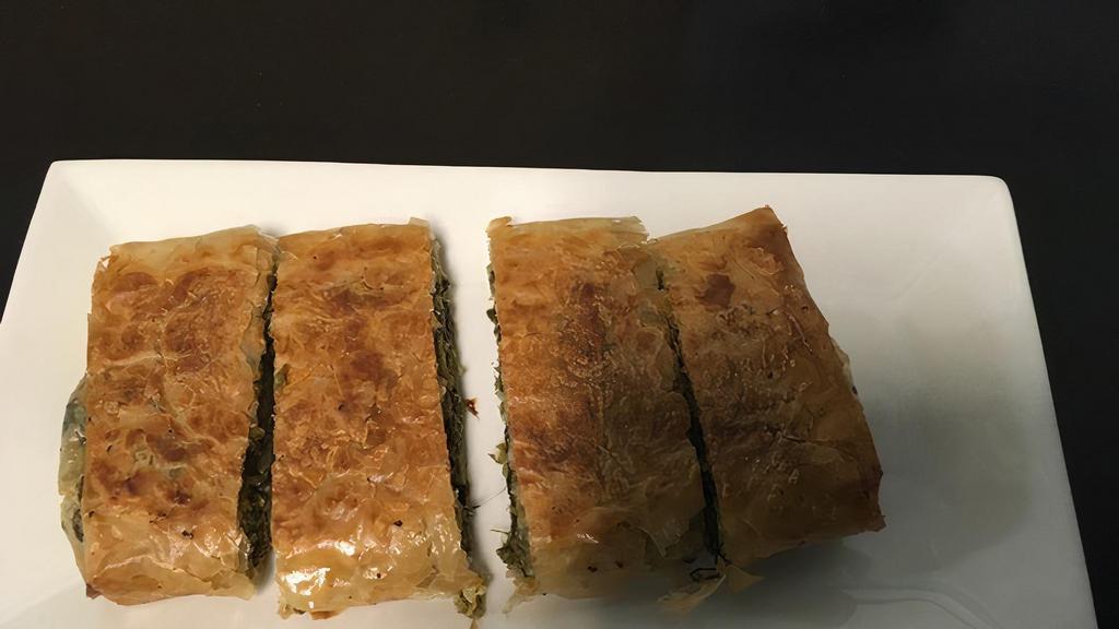 Spanakopita Appetizer (V) · Greek spinach pie wrapped in phyllo dough.