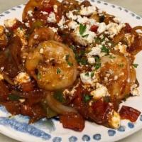 Shrimp Saganaki · Sautéed shrimp with fresh garlic, red onions, peppers, tomatoes, red wine, feta cheese, and ...