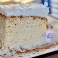 Tres Leches · A latin delight.  A dense, moist “three milks” cake topped with a cloud of vanilla whipped c...