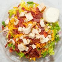 Cobb · Romaine, corn, tomatoes, red onion, cheddar, egg, turkey bacon, herb chicken and ranch dress...