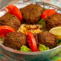 Falafel Platter · Deep-fried chickpeas and vegetables seasoned with middle eastern spices, topped with humus a...