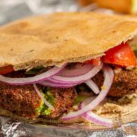 Falafel Sandwich · Deep-fried chickpeas and vegetables seasoned with middle eastern spices, with tahini sauce, ...