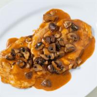 Chicken Marsala · Sautéed with marsala wine, mushrooms, and veal demi-glace.
