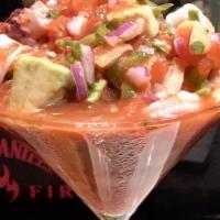 Ceviche De Mariscos · Lightly spicy shrimp, calamari, octopus, clams, mussels, cooked in lime and cilantro