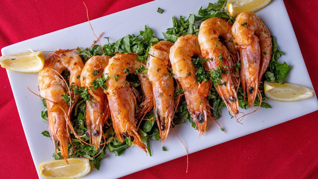 Gambas A La Plancha · Seared head on shrimp, rock sea salt, olive oil & lemon.
