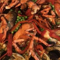 Paella Valenciana (Per Person) · Lobster tail, shrimp, clams, mussels, chicken, chorizo, sofrito, saffron rice.