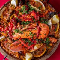 Paella Marinera (Per Person) · Lobster, shrimp, mussels, clams, fish, sofrito, saffron rice.