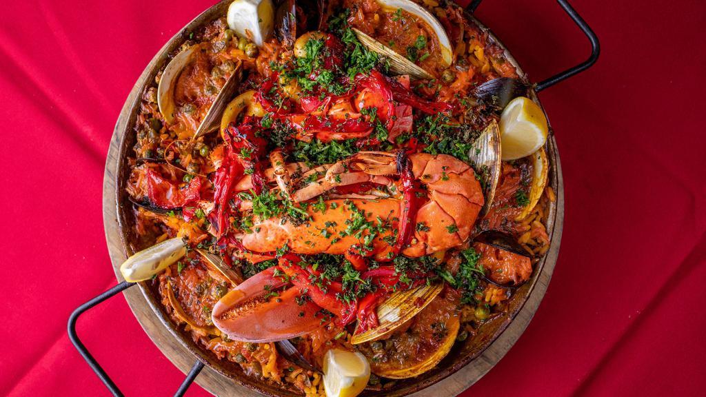 Paella Marinera (Per Person) · Lobster, shrimp, mussels, clams, fish, sofrito, saffron rice.