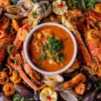 Parillada De Mariscos (2P) · Grilled lobster, clams, mussels, shrimp, filet of sole, snow crab leg, and crab stuffed mush...
