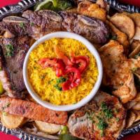 Parillada De Carne · Grilled top sirloin, short rib, pork chop, chorizo, and chicken breast