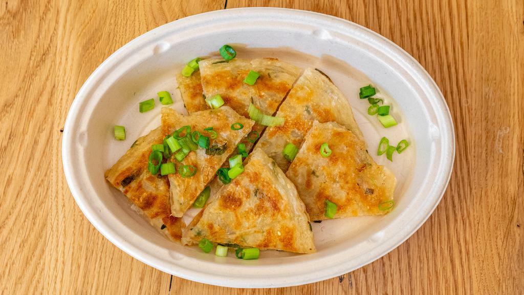 Scallion Pancake · Flaky scallion pancake served with 4 pieces.