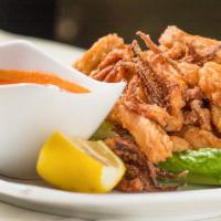 Calamari Fritti · Fresh squid flash fried. Served with marinara sauce.
