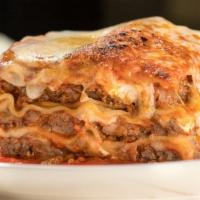 Lasagna Bolognese · Layered pasta with fresh mozzarella, Parmesan cheese, fresh ricotta, and meat sauce.