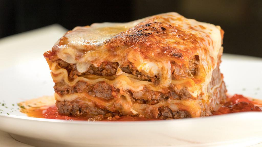 Lasagna Bolognese · Layered pasta with fresh mozzarella, Parmesan cheese, fresh ricotta, and meat sauce.