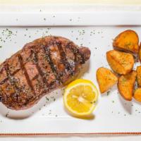 Grilled New York Strip · Certified Angus Beef, charcoal grilled, and seasoned with a peppercorn butter aioli.