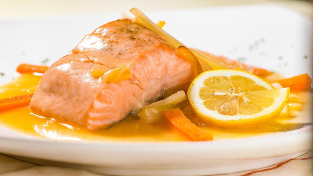 Salmon Affogato · Filet of salmon from faroe island with carrots, onions, and celery in a white wine lemon sauce.
